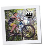 Photo of kids on mountain bikes